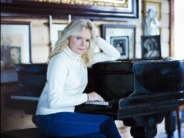 Sitting at Edvard Grieg’s piano at his home in Bergen, Troldhaugen.